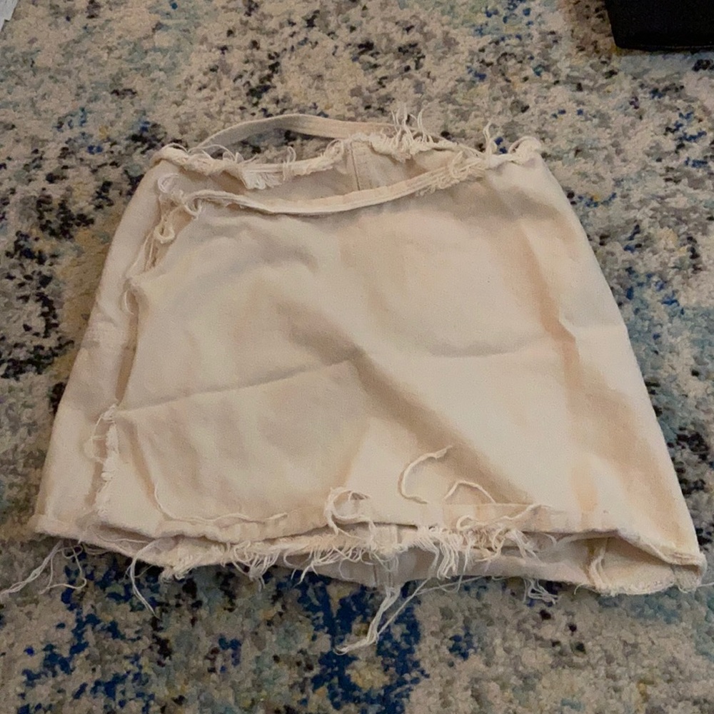 Distressed white jean skirt